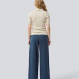 Soft knittet polo in 100% organic cotton. ToniaMD SS polo has short sleeves and a placket with 4 buttons.