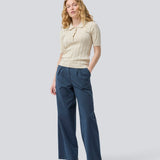 Soft knittet polo in 100% organic cotton. ToniaMD SS polo has short sleeves and a placket with 4 buttons.