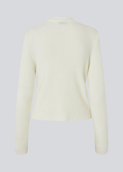 Fitted off white cardigan in a soft knit. TreeMD cardigan has a high neck and a zipper closure in front.