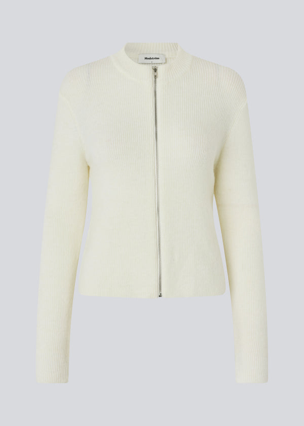 Fitted off white cardigan in a soft knit. TreeMD cardigan has a high neck and a zipper closure in front.