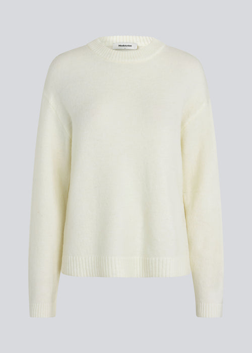 Loose off white knit in plain jersey knit. TreeMD o-neck has a round neckline and long loose sleeves.
