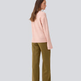 Loose knit in a light rose color in plain jersey. TreeMD o-neck has a round neckline and long loose sleeves.