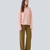 Loose knit in a light rose color in plain jersey. TreeMD o-neck has a round neckline and long loose sleeves.
