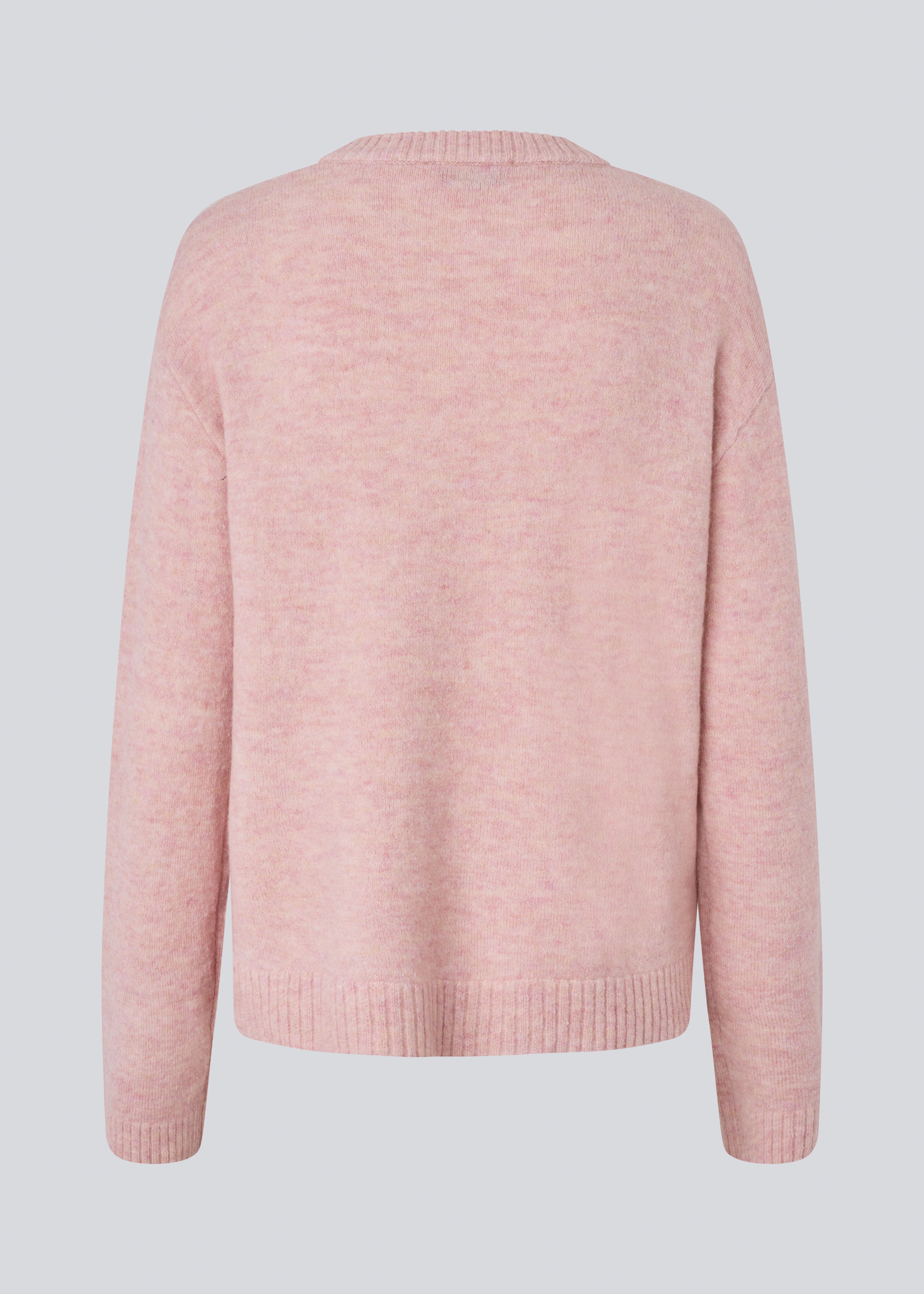 Loose knit in a light rose color in plain jersey. TreeMD o-neck has a round neckline and long loose sleeves.