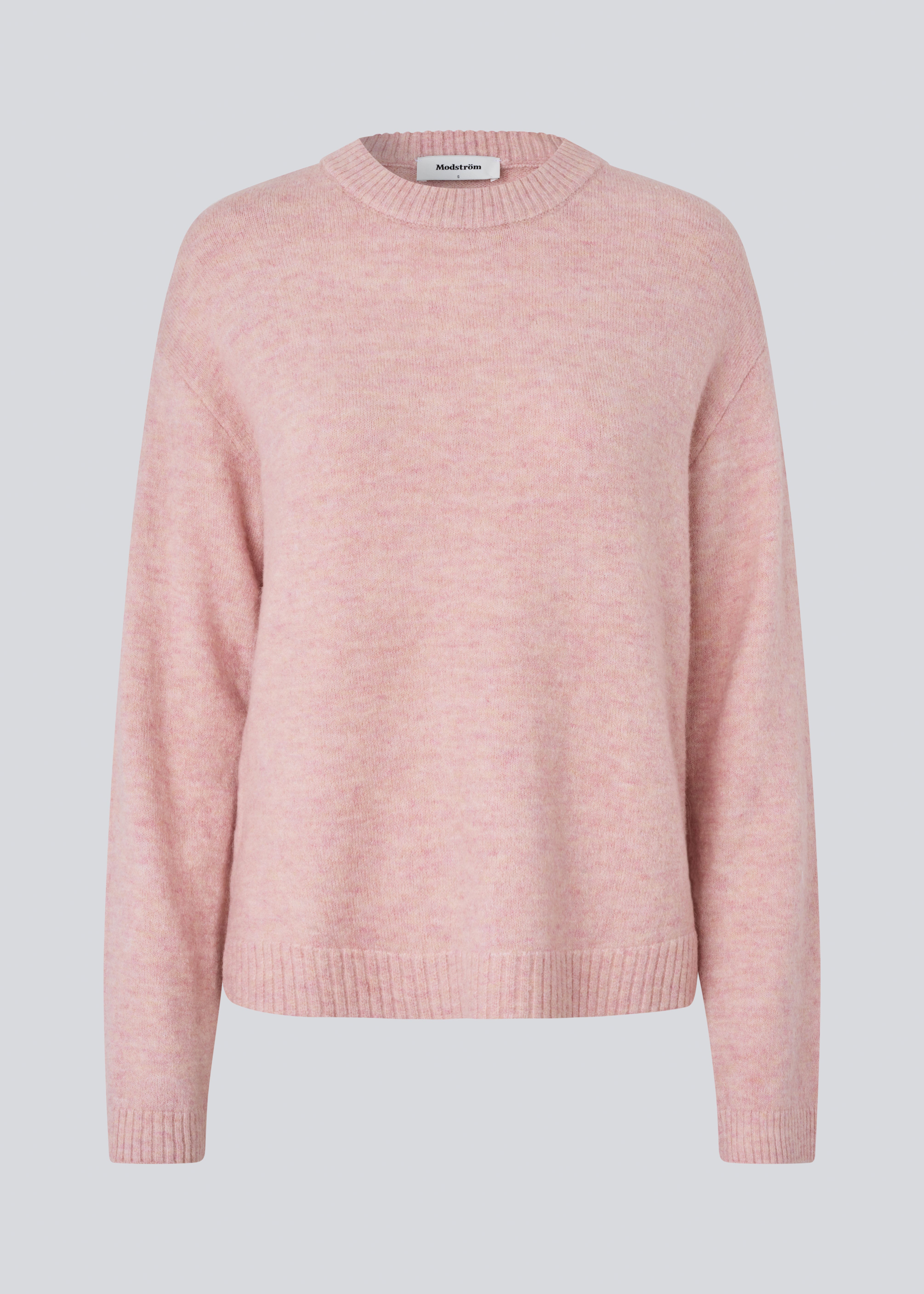 Loose knit in a light rose color in plain jersey. TreeMD o-neck has a round neckline and long loose sleeves.