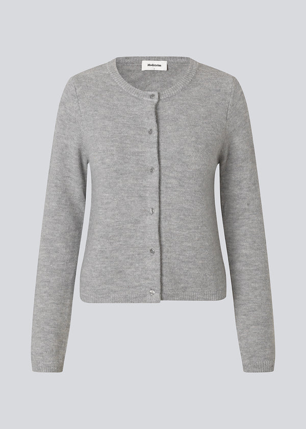 Light grey fitted cardigan in soft knit. The TreeMD cardigan features a round neckline and delicate buttons in a matching color, highlighting its simple and feminine expression.
