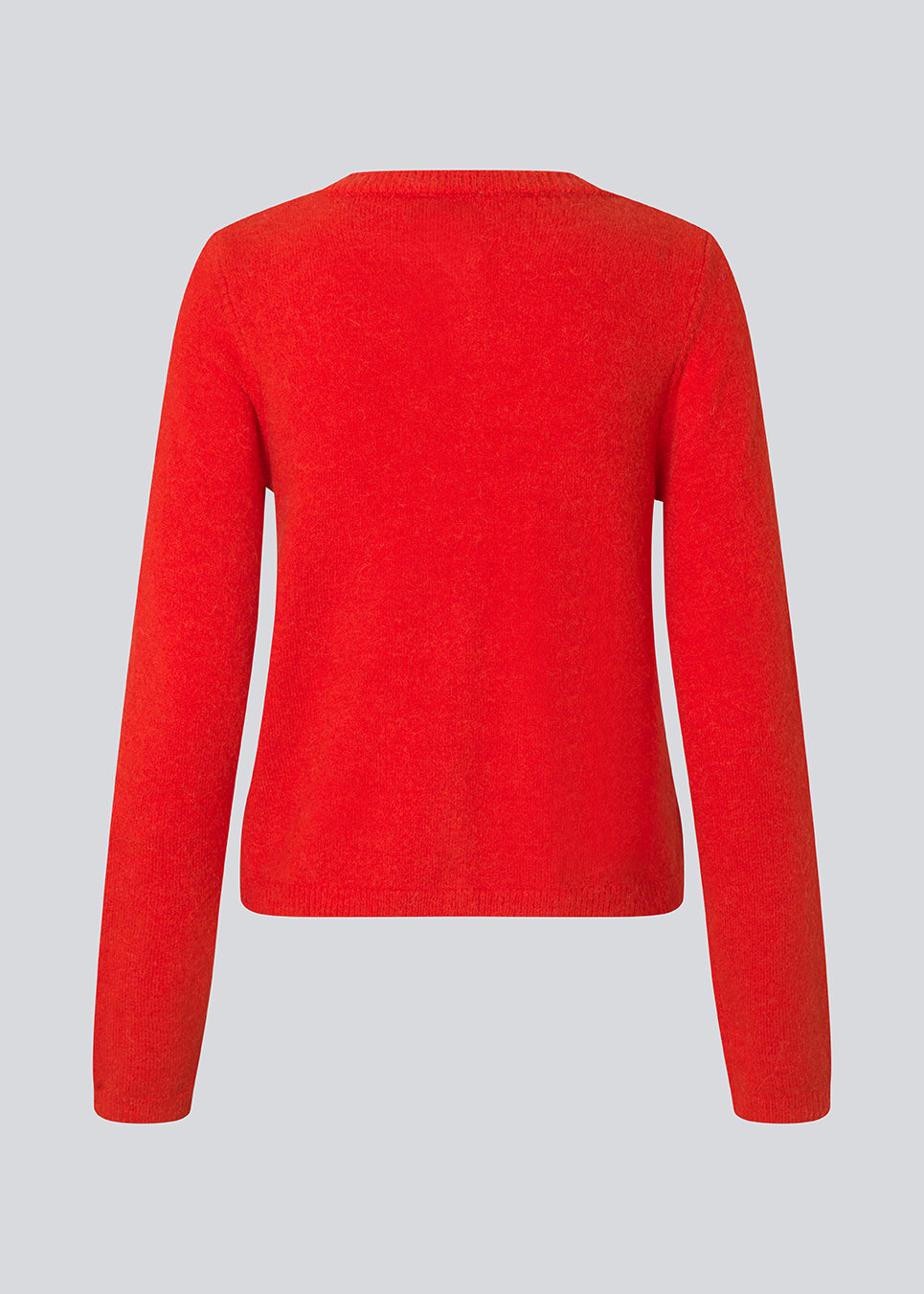 Red fitted cardigan in soft knit. The TreeMD cardigan features a round neckline and delicate buttons in a matching color, highlighting its simple and feminine expression.