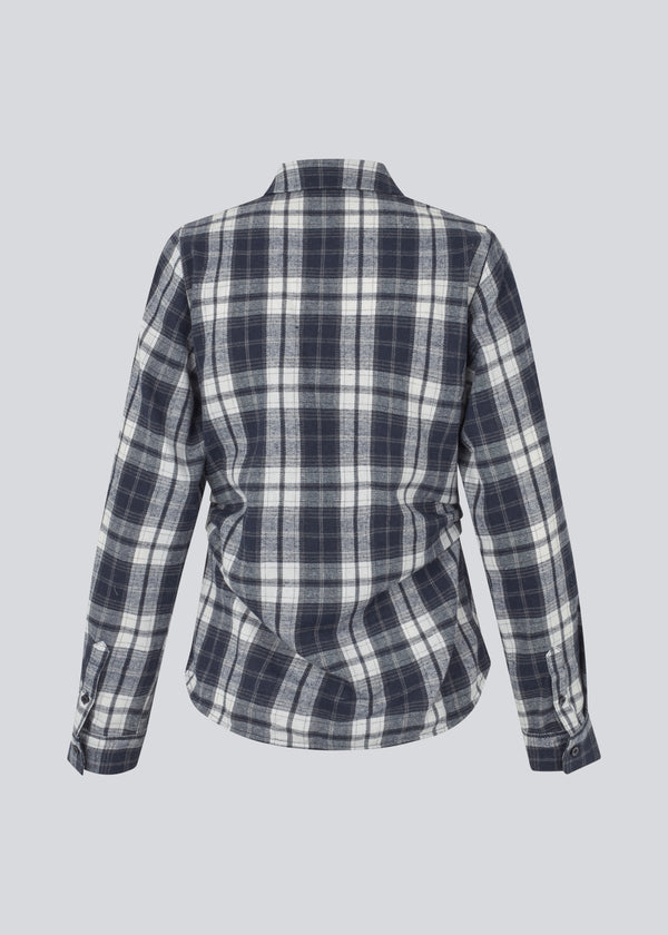Fitted shirt in flannel. TappoMD shirt has a button closure in front and a manchet with button closure.&nbsp;