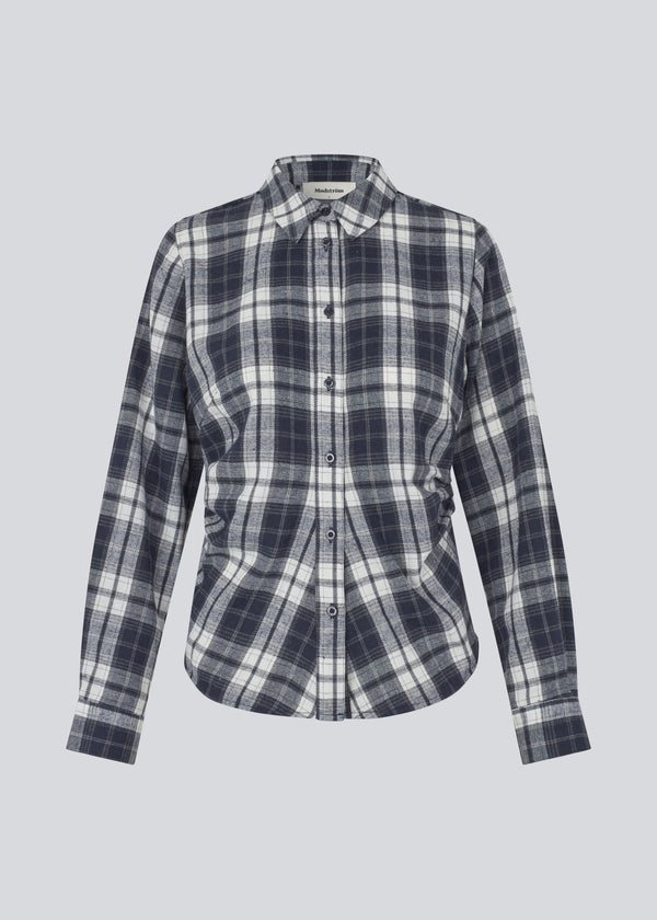 Fitted shirt in flannel. TappoMD shirt has a button closure in front and a manchet with button closure.&nbsp;