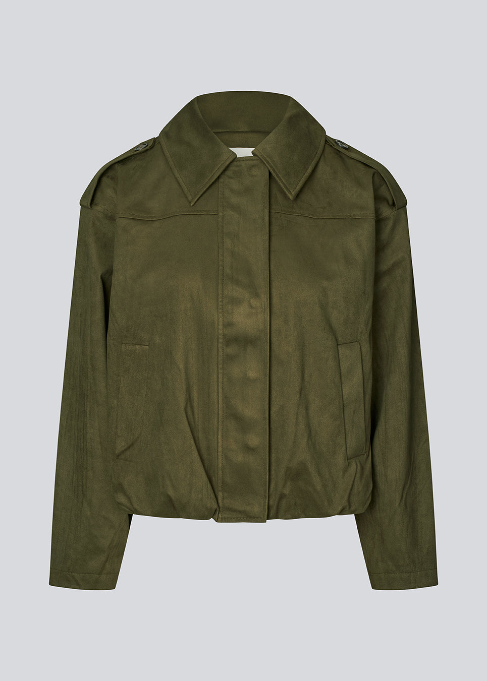 Short green jacket made from a soft, suede-like material. Features a classic shirt collar, hidden zip and button closure at the front, and practical front pockets. The structured shoulders with strap details and the slightly elasticated hem add a modern, tailored touch. A versatile and stylish piece, perfect for transitional weather and everyday wear.