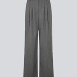 Grey suit pants with pleats and wide legs. Tuesdaymd pants have a medium-highwaist, zipper, side pockets and paspoil pockets in the back. The model is 175 cm and wears a size s/36.