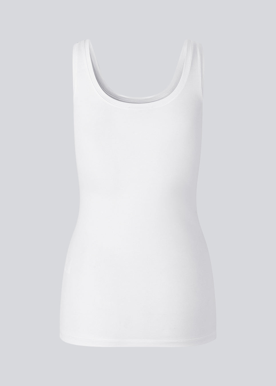 Nice and classic white basic top with wide straps and in a tight fit. Tulla is a must-have for any wardrobe and a Modström bestseller every season.