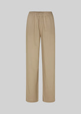 Long pants in the color Dune with a relaxed fit and long wide legs and elasticated waist for extra comfort. TulsiMD pants are made from a soft mix of linen and rayon. The model is 177 cm and wears a size S/36.