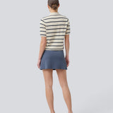 Short flared skirt in a stretchy material in dark blue. TurnerMD flare skirt has an elastic waistband. Match the skirt with the top: TurnerMD tank top.