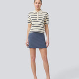 Short flared skirt in a stretchy material in dark blue. TurnerMD flare skirt has an elastic waistband. Match the skirt with the top: TurnerMD tank top.