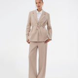 Comfortable suit trousers in beige with an elasticated waistband at the back. The UcheMD Pants feature a concealed zip fastening, pressed creases, and combine relaxed comfort with an elegant finish. Made from 63% recycled polyester. The model is 175 cm and wears a size S/36.

Style the pants with matching vest and blazer

Material:
4% Elastane
63% Recycled Polyester
33% Rayon

Lining:
100% Polyester