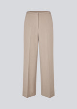 Comfortable suit trousers in beige with an elasticated waistband at the back. The UcheMD Pants feature a concealed zip fastening, pressed creases, and combine relaxed comfort with an elegant finish. Made from 63% recycled polyester. The model is 175 cm and wears a size S/36.

Style the pants with matching vest and blazer

Material:
4% Elastane
63% Recycled Polyester
33% Rayon

Lining:
100% Polyester