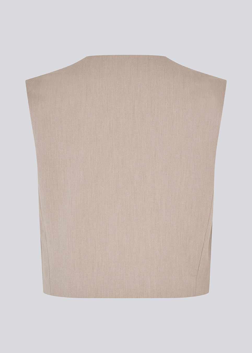 Minimalist vest in beige with clean lines. The UcheMD vest is sleeveless with a round neckline and a concealed closure – perfect for layering or worn on its own. Made from 63% recycled polyester.

Style the vestwith matching pants: Uchemd pants

Material:
4% Elastane
63% Recycled Polyester
33% Rayon

Lining:
100% Polyester