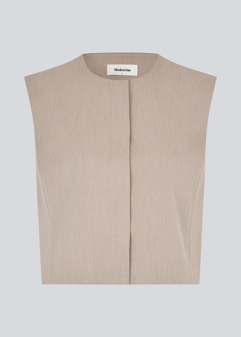 Minimalist vest in beige with clean lines. The UcheMD vest is sleeveless with a round neckline and a concealed closure – perfect for layering or worn on its own. Made from 63% recycled polyester.

Style the vestwith matching pants: Uchemd pants

Material:
4% Elastane
63% Recycled Polyester
33% Rayon

Lining:
100% Polyester