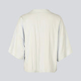 Minimalist shirt in beige with wide 3/4 sleeves. The UddinMD Shirt features a loose and comfortable fit, a classic shirt collar, a feminine V-neckline, and button closure.

Material:
27% Polyamide
73% Viscose