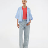 Minimalist shirt in light blue with wide 3/4 sleeves. The UddinMD Shirt features a loose and comfortable fit, a classic shirt collar, a feminine V-neckline, and button closure. Modellen er 175 cm og har en str. S/36 på.

Material:
27% Polyamide
73% Viscose