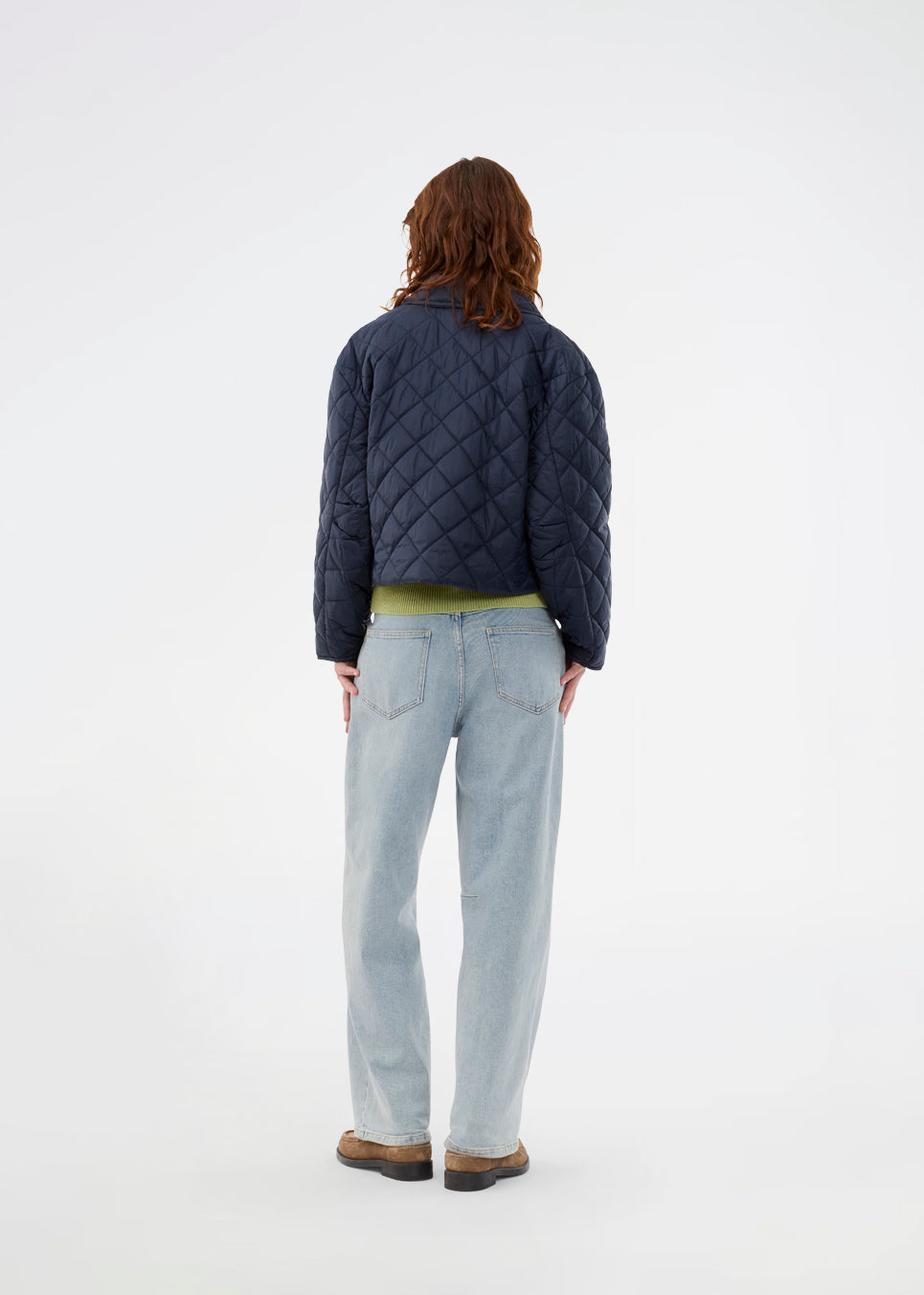 Short navy quilted jacket in 100% recycled nylon. The Uffemd jacket has a light, casual look with a shirt collar, press buttons, and practical side pockets – an ideal layer for the transitional seasons. The model is 175 cm and wears a size S/36.


Material:
100% Recycled nylon

Lining:
100% Polyester

Filling:
100% Polyester