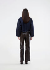 Short jacket in navy with modern and practical details. The Ulrikkemd jacket features a classic collar, large front flap pockets, an adjustable drawstring at the waist, and is crafted from glossy nylon that gives it a sleek and sporty look. The model is 175 cm and wears a size S/36.

Material:
100% Nylon

Lining:
100% Polyester

Filling:
100% Polyester