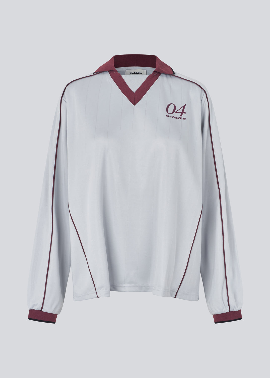 Cool long-sleeved T-shirt with a polo collar. The UniqueMD LS T-shirt features sporty details such as elastic trims, a V-neckline, and a number and logo on the chest. A relaxed yet stylish piece that combines comfort with modern design.