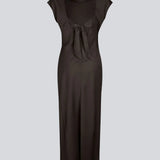 Elegant satin dress in brown made from 96% recycled polyester. The UnityMD Dress features short sleeves, an ankle-length silhouette, and beautiful draping at the waist that accentuates the figure. The deep back and tie detail add a feminine and sophisticated touch.

Material:
4% Elastane
96% Recycled Polyester