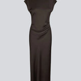 Elegant satin dress in brown made from 96% recycled polyester. The UnityMD Dress features short sleeves, an ankle-length silhouette, and beautiful draping at the waist that accentuates the figure. The deep back and tie detail add a feminine and sophisticated touch.&nbsp;

Material:
4% Elastane
96% Recycled Polyester
