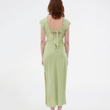 Elegant satin dress in green made from 96% recycled polyester. The UnityMD Dress features short sleeves, an ankle-length silhouette, and beautiful draping at the waist that accentuates the figure. The deep back and tie detail add a feminine and sophisticated touch. The model is 175 cm and wears a size S/36.


Material:
4% Elastane
96% Recycled Polyester