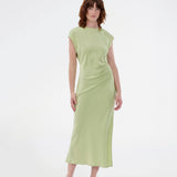 Elegant satin dress in green made from 96% recycled polyester. The UnityMD Dress features short sleeves, an ankle-length silhouette, and beautiful draping at the waist that accentuates the figure. The deep back and tie detail add a feminine and sophisticated touch. The model is 175 cm and wears a size S/36.


Material:
4% Elastane
96% Recycled Polyester