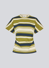 Fitted T-shirt with fresh green stripes. The UrbanMD Stripe T-shirt features short sleeves, a round neckline, and delicate ruched stitching at the waist that accentuates the silhouette. A discreet chest logo completes the modern look. The model is 175 cm and wears a size S/36.


Material:
52% Cotton
48% Polyester