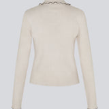 Elegant knitted blouse in beige with contrast stitching. The UrdMD LS Top is made from 100% organic cotton and features a collar, long sleeves, and button detailing. A timeless and feminine choice for any occasion. The model is 175 cm and wears a size S/36. 

Material:
95% Organic Cotton
5% Elastane