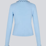 Elegant knitted blouse in light blue with contrast stitching. The UrdMD LS Top is made from 100% organic cotton and features a collar, long sleeves, and button detailing. A timeless and feminine choice for any occasion. The model is 175 cm and wears a size S/36.

Material:
95% Organic Cotton
5% Elastane