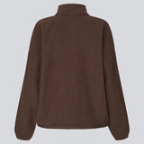 Soft fleece sweater in brown made from 100% recycled polyester. The UrielMD Fleece is designed with a high collar, half-zip closure, and a relaxed fit that creates a modern and effortless look. Perfect for chilly days and casual layering. The model is 175 cm and wears a size S/36.

Material:
100% Recycled Polyester