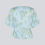 Light and feminine blouse in blue with a romantic floral print. The UttaMD SS Top is designed with short, wide sleeves and a relaxed fit for an elegant and effortless look. Made from 100% recycled polyester. The model is 175 cm and wears a size S/36.

Material:
100% Recycled Polyester