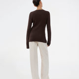 Timeless rib-knit cardigan in brown with a round neckline and front button closure. The UvisMD Cardigan features a fitted silhouette and a soft quality that gives it a feminine and elegant look. Perfect for everyday wear and layering through the seasons. The model is 175 cm and wears a size S/36.

Material:
100% Organic Cotton
