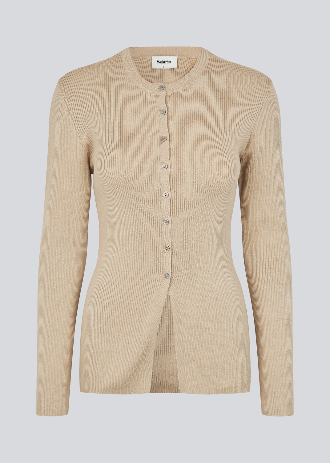 Timeless rib-knit cardigan in beige with a round neckline and front button closure. The UvisMD Cardigan features a fitted silhouette and a soft quality that gives it a feminine and elegant look. Perfect for everyday wear and layering through the seasons. The model is 175 cm and wears a size S/36.



Material:
100% Organic Cotton