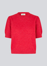 Feminine knit sweater in red with short sleeves and a subtle puff. The UzziMD SS O-neck features a round neckline and delicate ribbed trims, creating an elegant and timeless look. The model is 175 cm and wears a size S/36.


Material:
76% Acrylic
24% Polyester