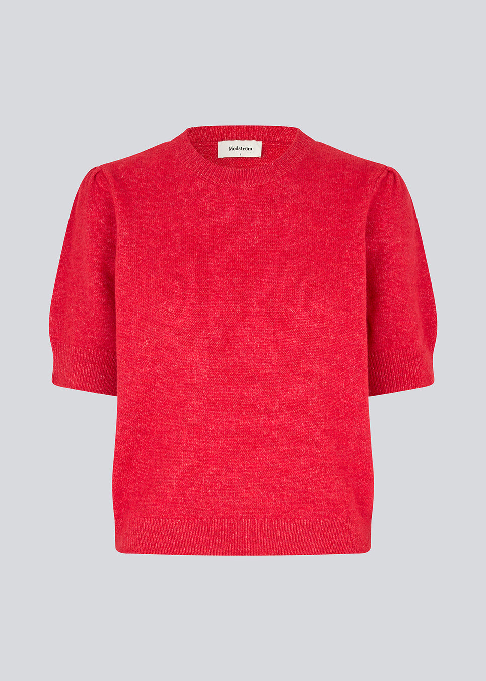 Feminine knit sweater in red with short sleeves and a subtle puff. The UzziMD SS O-neck features a round neckline and delicate ribbed trims, creating an elegant and timeless look. The model is 175 cm and wears a size S/36.


Material:
76% Acrylic
24% Polyester
