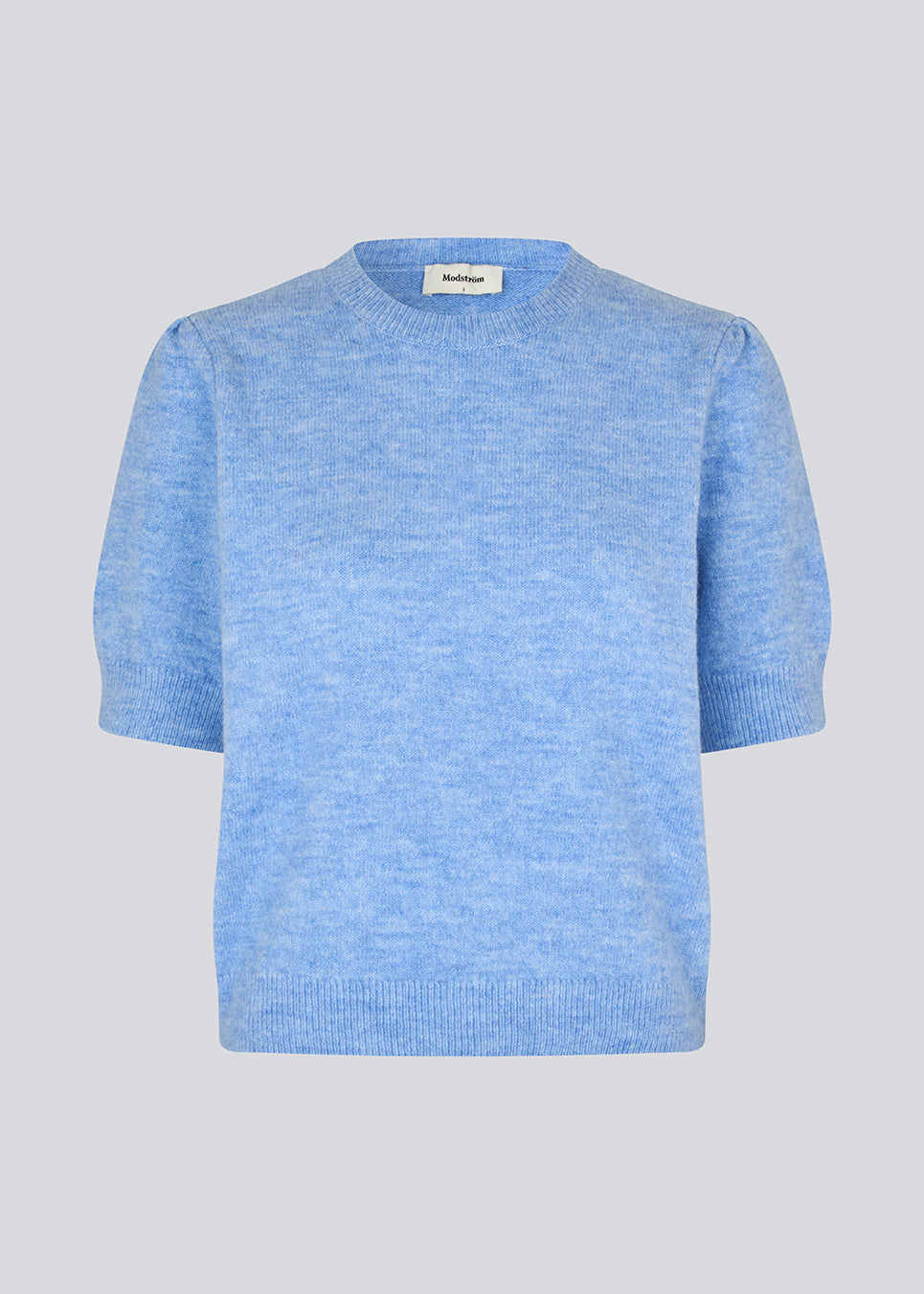 Feminine light blue knit sweater with short sleeves and a subtle puff. The UzziMD SS O-neck features a round neckline and delicate ribbed trims, creating an elegant and timeless look.

Material:
76% Acrylic
24% Polyester