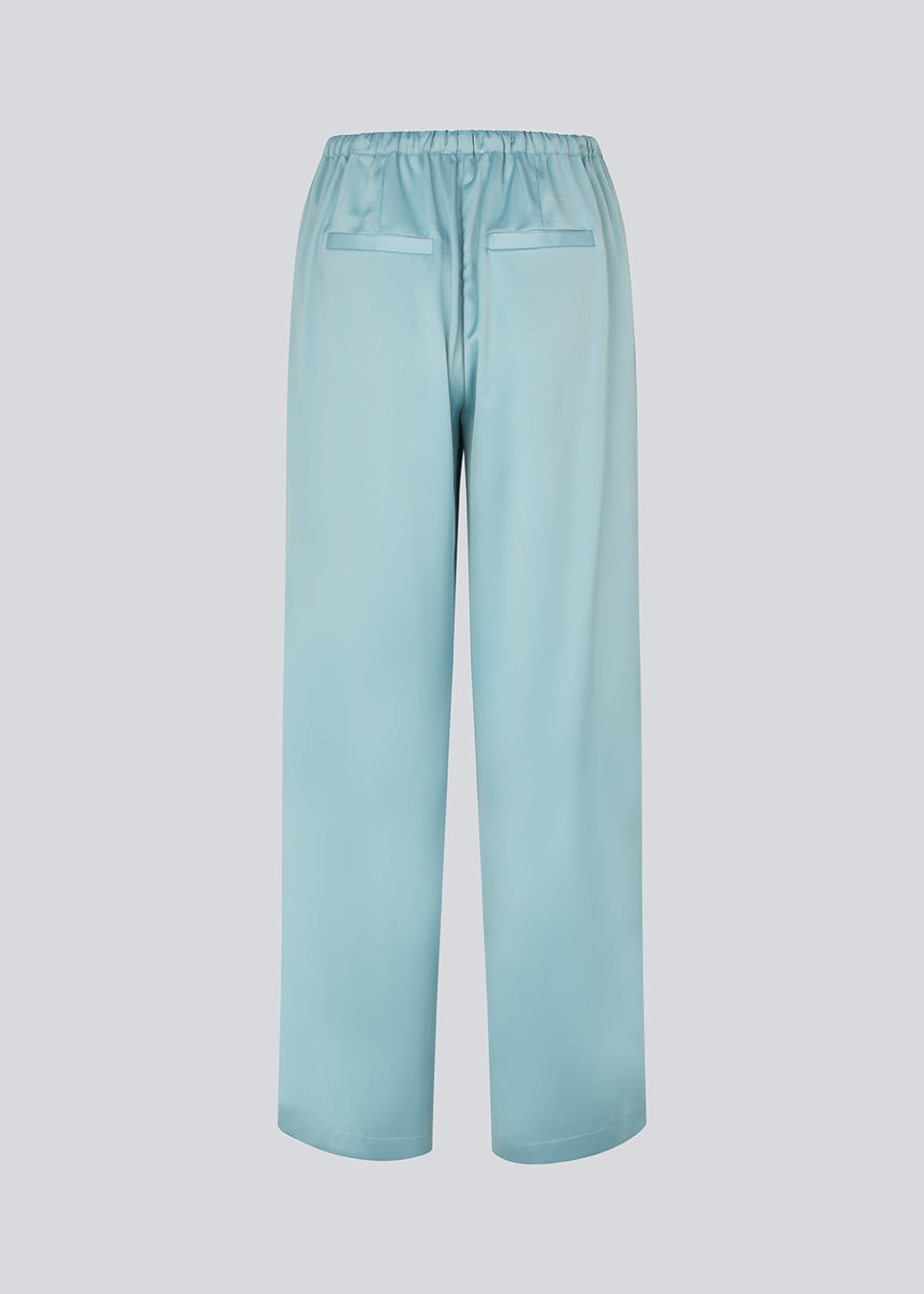 Elegant trousers in lightweight, lustrous satin. The Valdomd pants feature a loose and comfortable fit with an adjustable drawstring at the waist for a relaxed yet sophisticated look. Made from 98% recycled polyester.