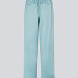 Elegant trousers in lightweight, lustrous satin. The Valdomd pants feature a loose and comfortable fit with an adjustable drawstring at the waist for a relaxed yet sophisticated look. Made from 98% recycled polyester.
