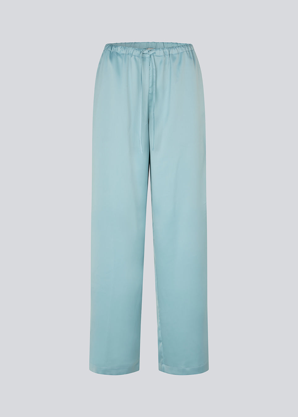 Elegant trousers in lightweight, lustrous satin. The Valdomd pants feature a loose and comfortable fit with an adjustable drawstring at the waist for a relaxed yet sophisticated look. Made from 98% recycled polyester.