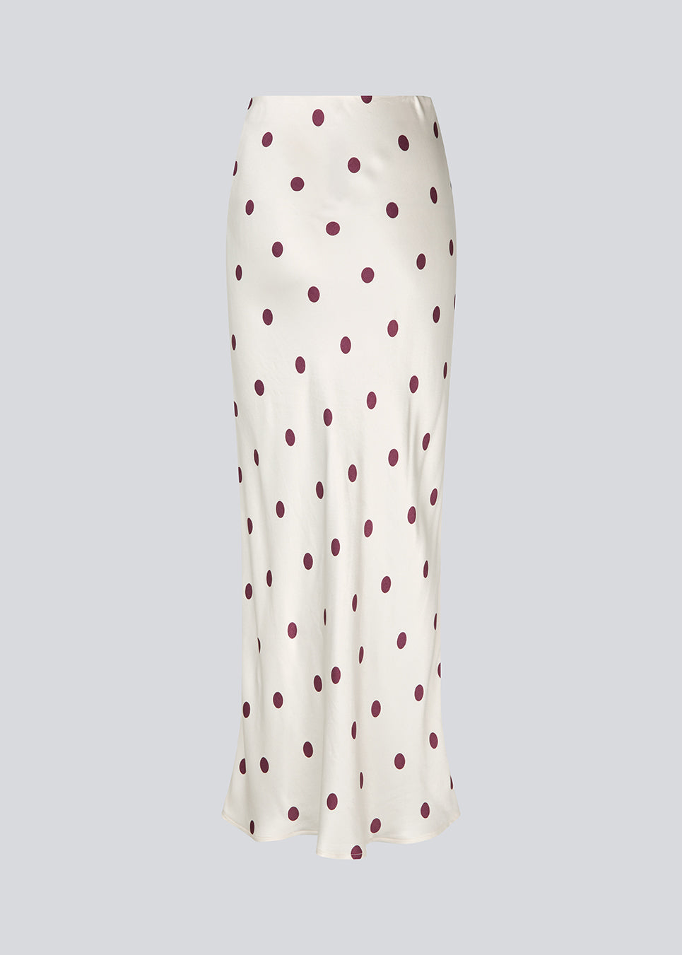 Long white satin skirt with polka dots. The Vanjamd Print Skirt features a loose, elegant drape and an elastic waistband for a comfortable and feminine look. Perfect for both everyday and evening outfits.