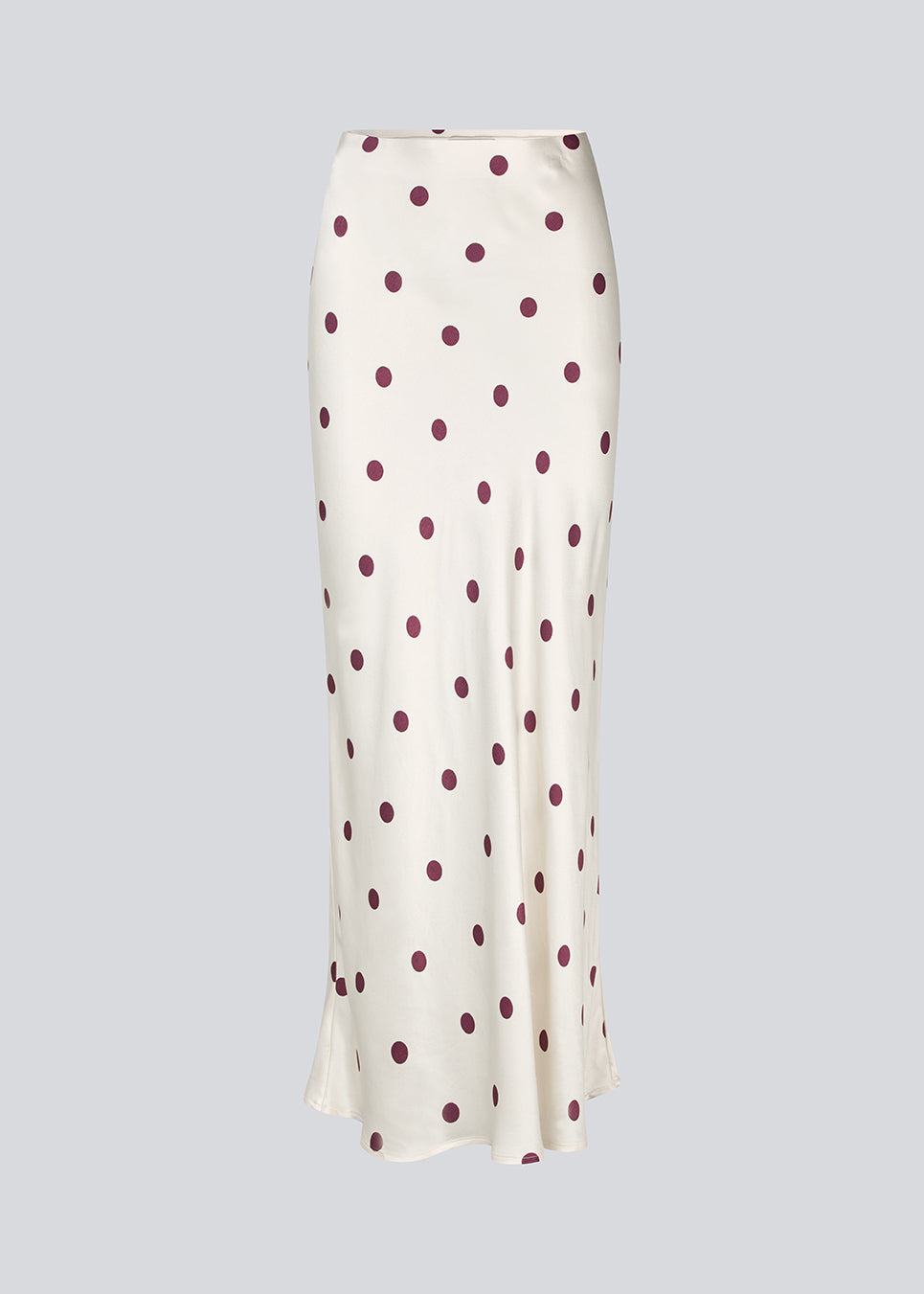 Long white satin skirt with polka dots. The Vanjamd Print Skirt features a loose, elegant drape and an elastic waistband for a comfortable and feminine look. Perfect for both everyday and evening outfits.