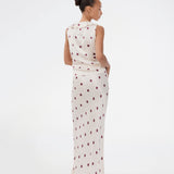 Polka-dotted sleeveless top with a ruffle trim. The Vanjamd Print Top is made from lustrous satin and features feminine details such as a V-neckline, ruching, and a tie detail under the bust for an elegant look.