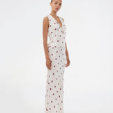 Polka-dotted sleeveless top with a ruffle trim. The Vanjamd Print Top is made from lustrous satin and features feminine details such as a V-neckline, ruching, and a tie detail under the bust for an elegant look.