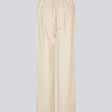 Elegant white tailored trousers with straight legs. The VesMD pants feature belt loops, a concealed zipper closure, and an elastic waistband at the back. These classic trousers create a stylish and versatile look, perfect for both the office and evening occasions.